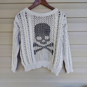 Cream Colored Open Knit Sweater with Skull and Cross Bones Design